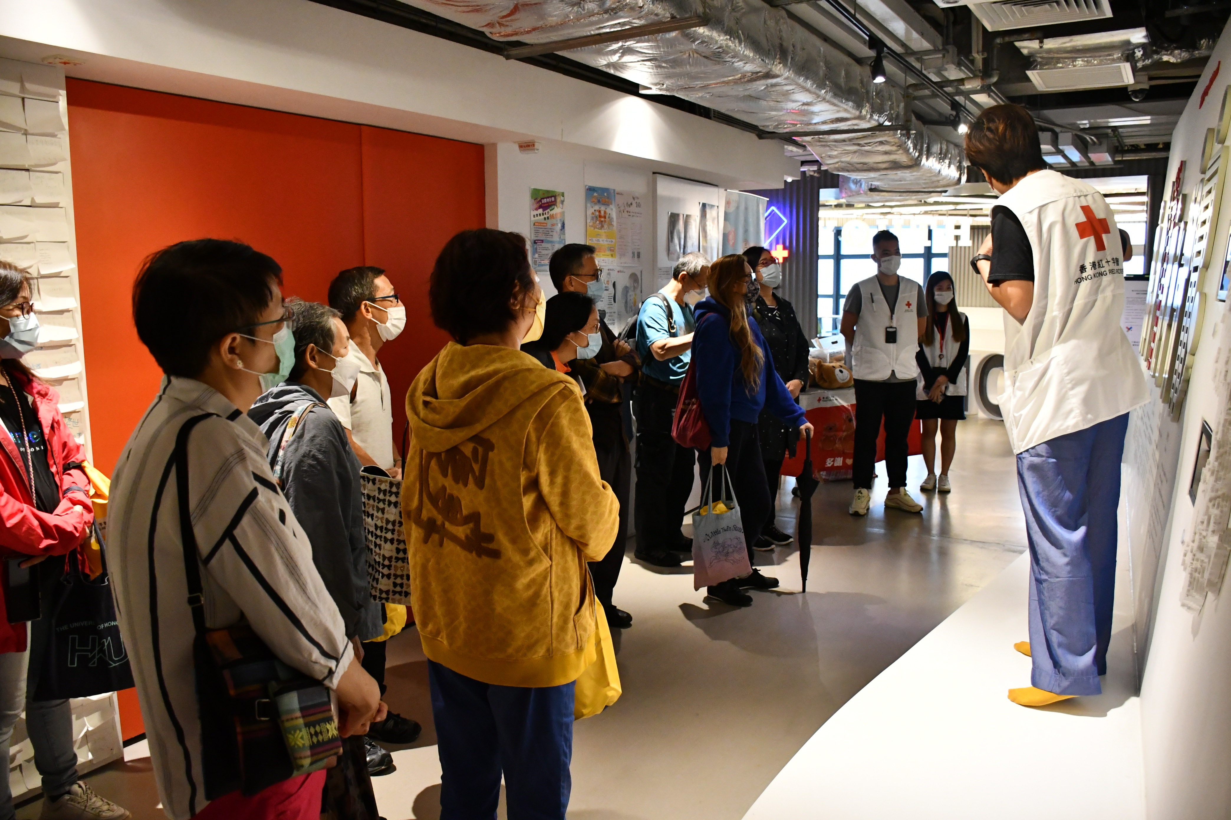 After the sharing session, the attendees were given a tour of the “Every One Matters” Photo Exhibition and “Humanity Wall” by HKRC representatives.